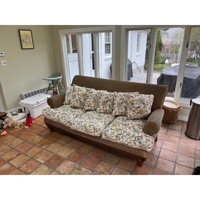 This Henry Link rattan wicker sofa is a charming vintage piece that brings effortless style to a three-season room,...