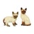 A vintage pair of Siamese cats made of glazed ceramic during the 1950s or 1960s, one is marked "Japan" on the bottom....