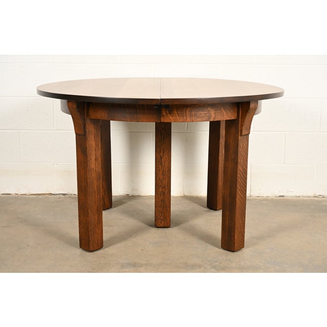 An outstanding antique Mission or Arts & Crafts period quarter sawn oak five-leg extension dining table By Limbert USA,...