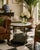 Elegant vintage accent table featuring a beautifully veined marble top supported by sculptural carved legs with decorative...