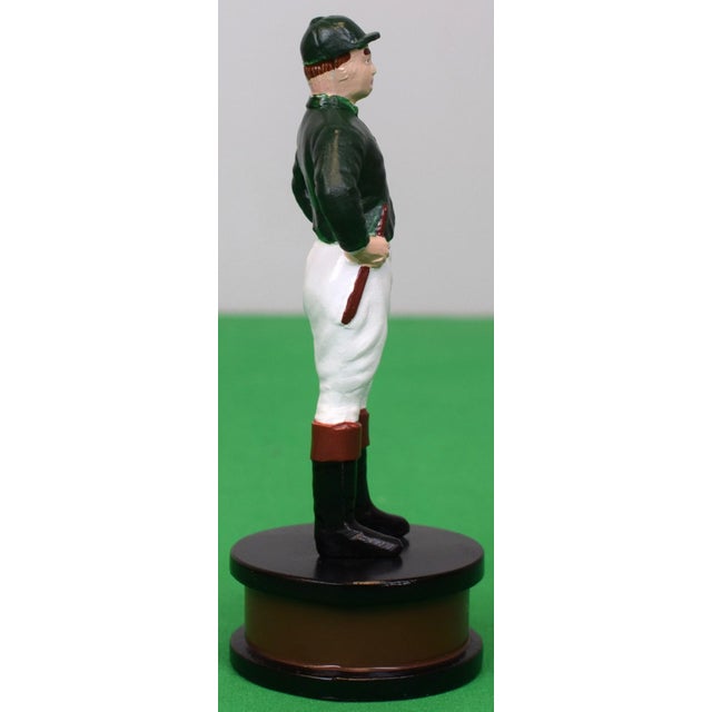 Sz: 6 3/4"H x 2 3/4"D at base Cast metal base with hand-colored hunter green racing 'silks' finish The 21 Club, often...