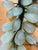 Beautiful naturalistic polished pair of vintage jadeite jade grape clusters.
