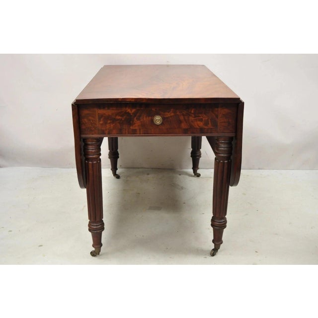 Antique 19th C. Federal Sheraton Crotch Mahogany Drop Leaf Breakfast Dining Table w/ Drawer. Item features drop leaf...