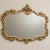 Make a statement with this elegant French Rococo-inspired wall mirror, featuring a beautifully sculpted frame with...