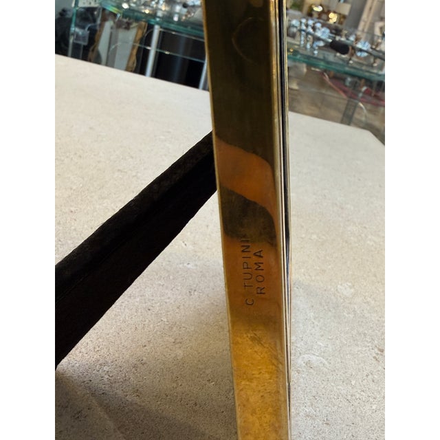 Elegant Italian picture frame from the 1970s, crafted in solid polished brass with a bold, architectural presence. The...