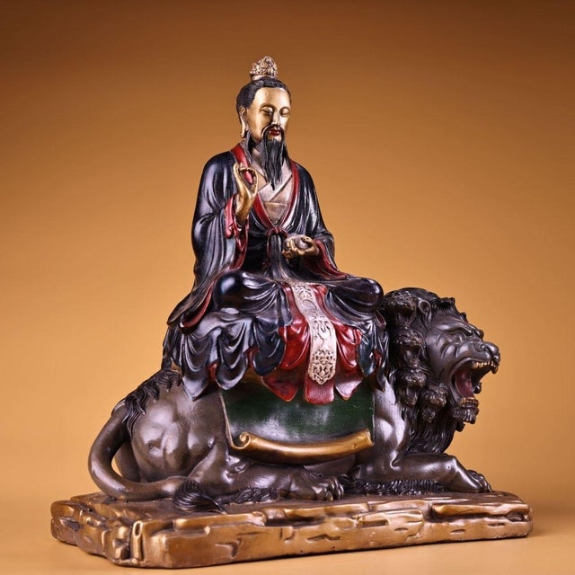 This is a substantial antique polychrome bronze sculpture depicting Taiyi Zhenren, a revered Taoist immortal. The figure...