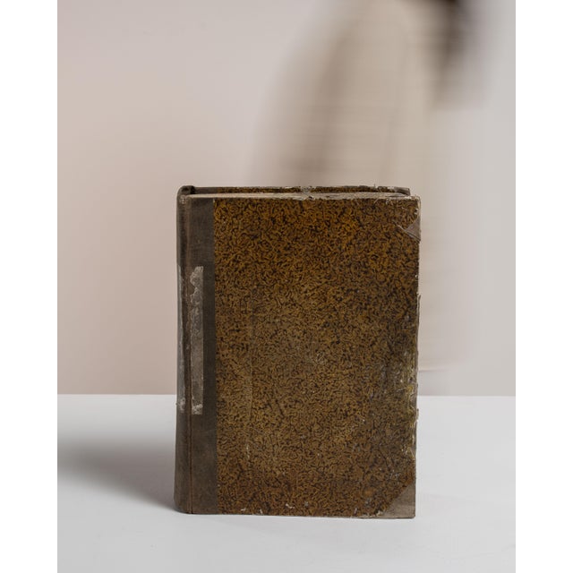 This early 20th century book from France is finished in chocolate, worked in wood. Its form follows honest, well-...