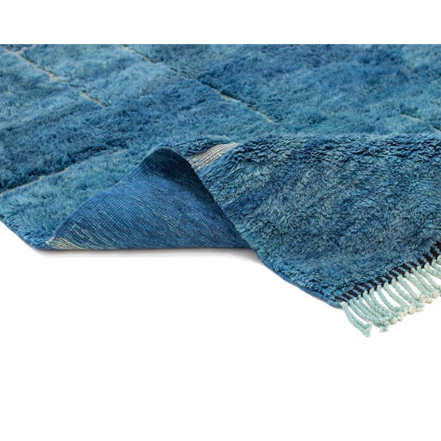 Luxurious hand-knotted wool rug, showcasing a rich blend of Azure Blue and Delicate Blue with a subtle handwoven linear...