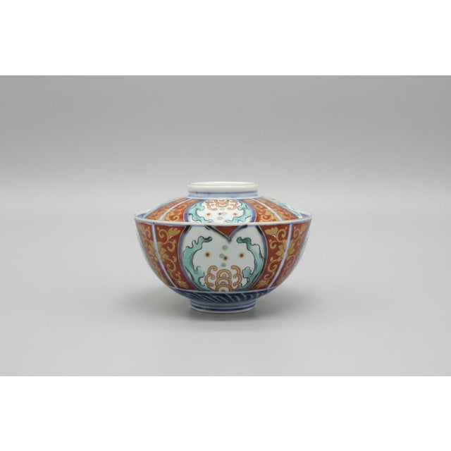 Antique Japanese Imari porcelain bowls with lids, set of 5. Each with alternating panels showing a hand painted floral...