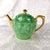 This is a green on green leaf patterned teapot by Pickard. I cannot find a pattern name for this item. The teapot comes...