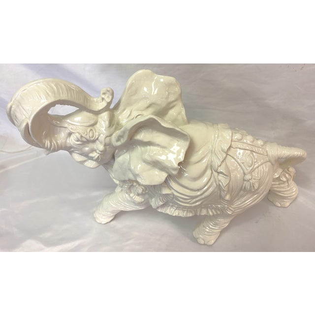 Pretty vintage ceramic elephant figure from the mid 20th century. Made of ceramic with a white finish, it features an...