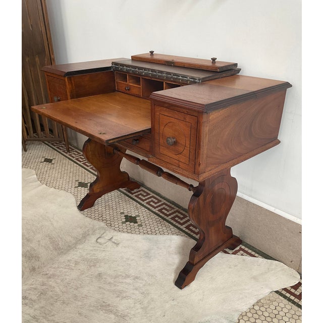 Bring timeless craftsmanship and clever, space-saving utility to your home with this exquisite Antique Spinet Desk,...