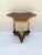 A hand‑made tripod side or ed table with an organic clover‑form top and lower tier, Rustic or Folk Art tradition, likely...