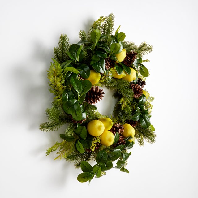 This timeless wreath features a cheerful faux mix of lemons, lemon foliage, evergreen branches, cedar & pine, and comes...