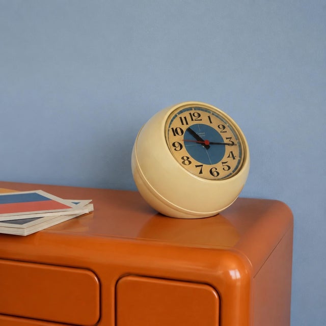 This original Space Age table clock was produced in Italy during the 1970s and combines a sculptural cream plastic body...