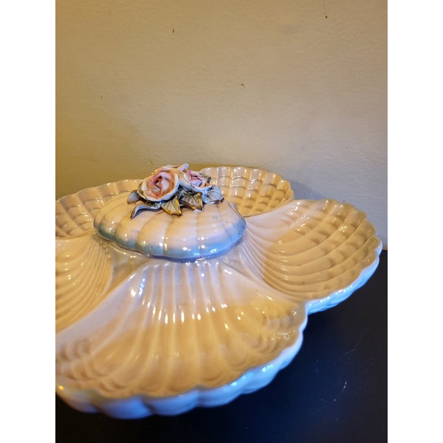 A beautiful 19th Century hand painted oyster plate by Ceramica De Cuernavaca, of Mexico. The beautiful flowers on this...