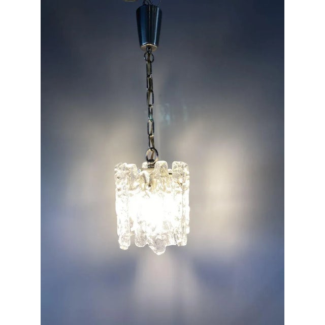 This chandelier from the 1960s by the Austrian designer J.T. Kalmar has the name Ice Glass apparently more than deserved....