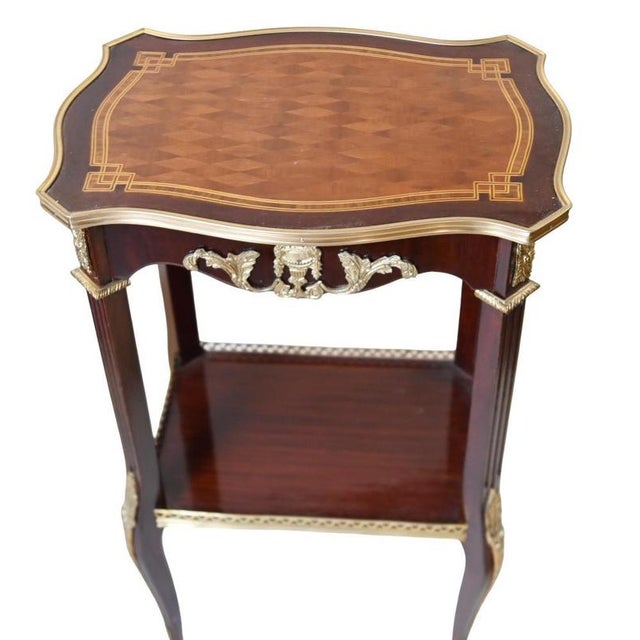 Elegant pair of French Louis XV style side tables Love the shaped tops with ormolu border Gorgeous pair ready to be the...