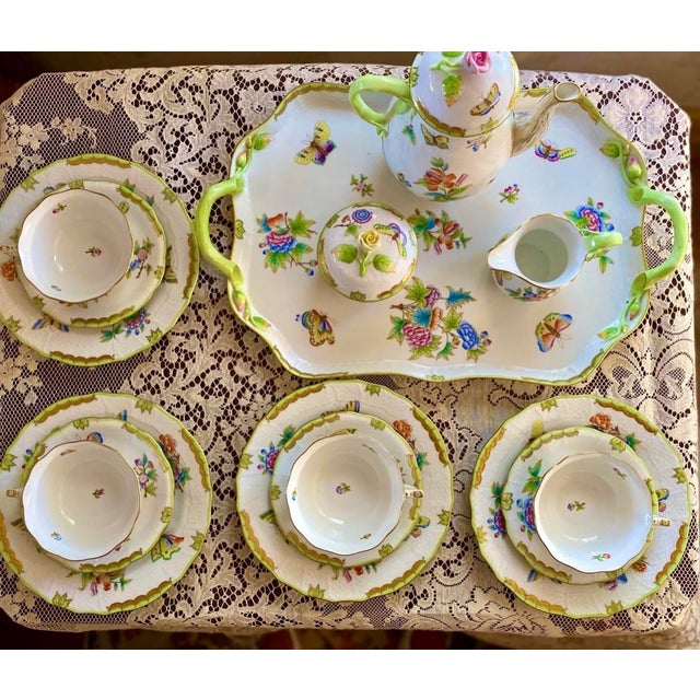 The Herend Queen Victoria Rectangular Tray with Branch Handles is a masterpiece of fine porcelain artistry, exemplifying...