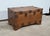 This completely in solid teak trunk is characterized by its many studded straps affirming its character. Assembly with...