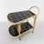 Height: 72 cm. Width: 75 cm. Depth: 43 cm. The trolley has 2 wooden shelves with a kind of tile motif. The top tile motif...