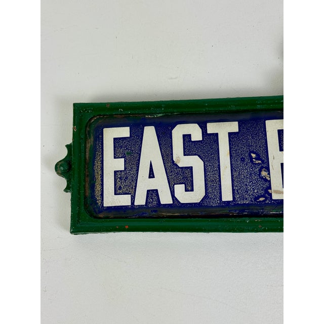 Metal Early 20th Century Double Sided Porcelain Enamel Street Sign in Cast Iron Ornate Frame For Sale - Image 7 of 11
