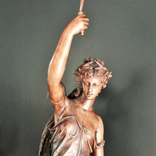 A monumental bronze lady sculpture. A fine monumental of 19th century Spanish lady sculpture with mahogany base....