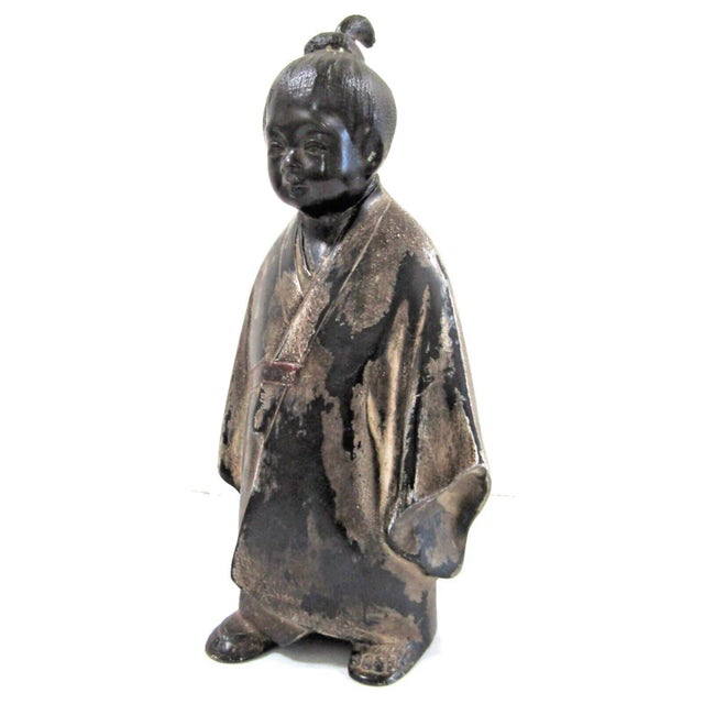 Vintage Japanese Okimono Bronze Sculpture Figure Selfless Child Well modeled with traces of gilt bronze, the figure of a...