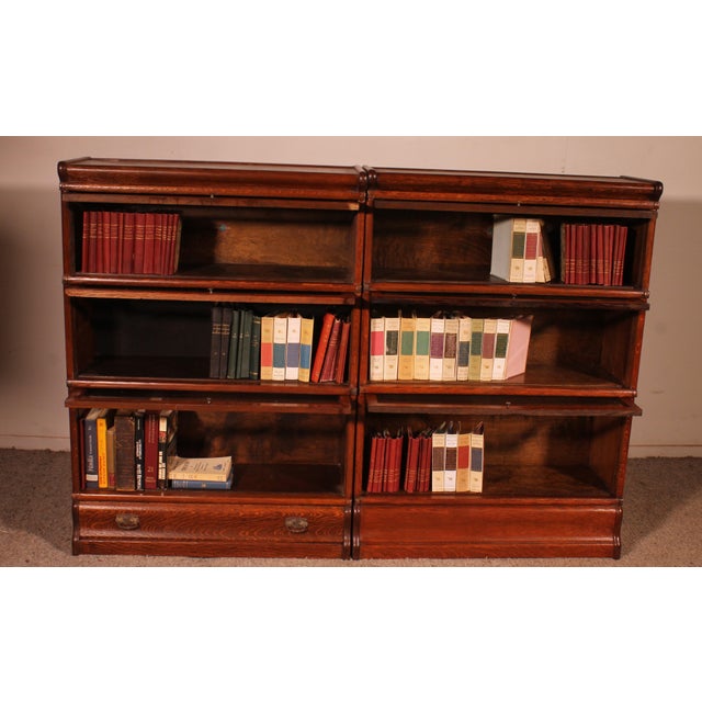 Elegant pair of Globe Wernicke London oak bookcases, late 19th/early 20th century, England. This charming pair of...