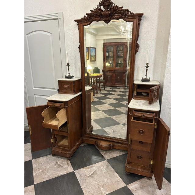 Mirror: Original beveled glass follows the curved contour of the walnut frame—a hallmark of master craftsmanship in the...