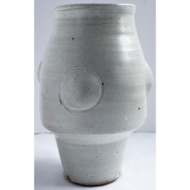 This extraordinary and unusual large stoneware vase with Shino glaze is made with Warren MacKenzie’s custom clay blend....