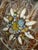 Beautiful vintage handpainted wrought iron floral wall hanging, reminiscent of the Hollywood Regency and Italian toleware...