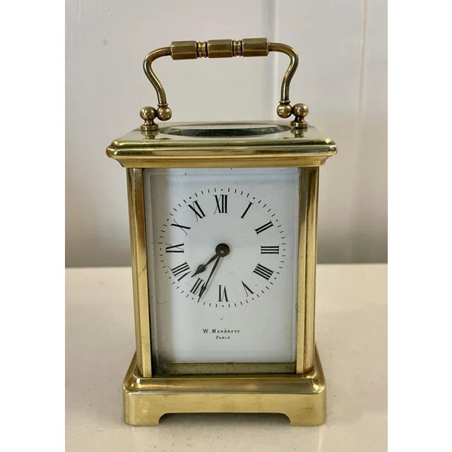 Antique Victorian quality brass carriage clock having bevelled edged glass panels, white enamel dial with Roman numerals,...