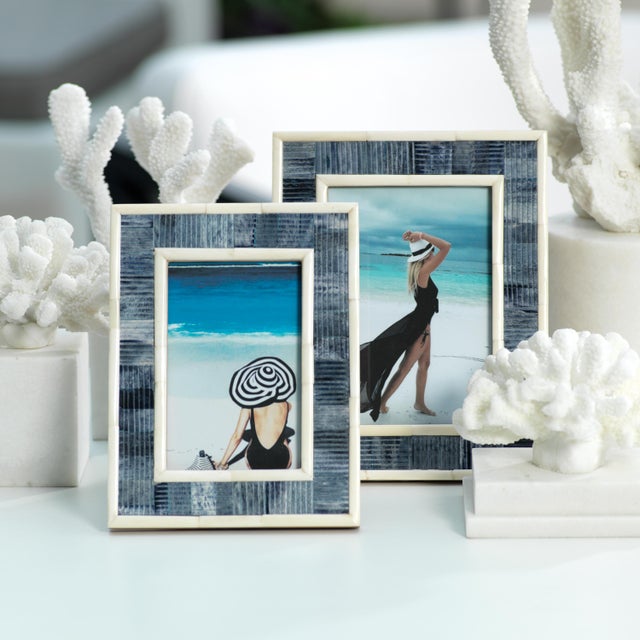 A beautiful line pattern wraps around this frame in a classic blue-and-white scheme. It would look lovely next to a vase...