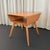 This iconic Mid-Century Modern open side table is by Heywood-Wakefield "Aristocraft" model M364. This solid maple lamp...