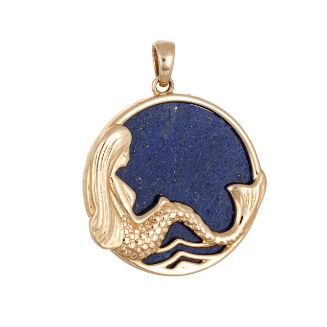 Distinct & stylish contemporary Mermaid pendant crafted in 14 karat yellow gold. Sitting in a relaxed pose the Mermaid...