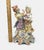 This elegant 9.5-inch tall ceramic bisque figurine depicts a courting couple in ornate, 18th-century style attire. The...
