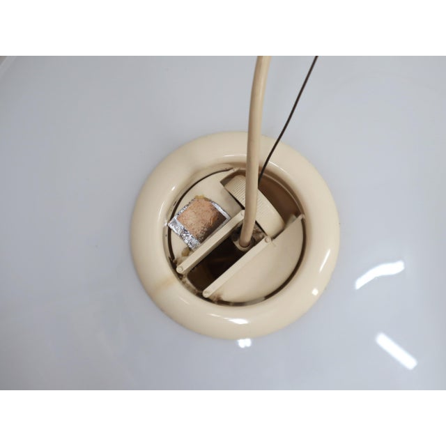 This iconic pendant lamp, designed in 1965 by pier giacomo and achille castiglioni for flos, embodies the elegance and...