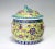 Gorgeous Kamcheng "covered vessel" in traditional form with a turquoise crouching lion finial and pink knob handles with...