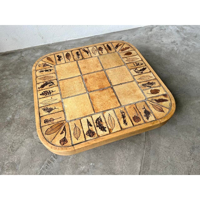 Rare coffee table by roger capron, square shape, light stain in solid beech. ceramic coffee table and solid beech base...