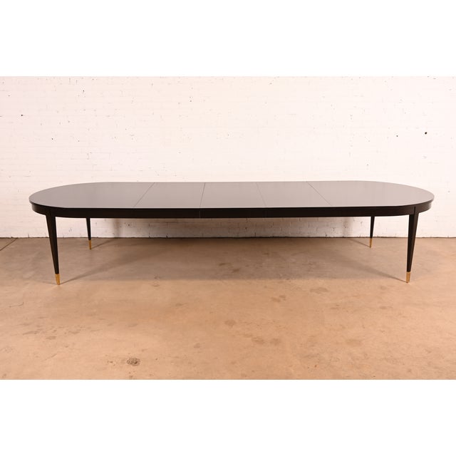A gorgeous French Regency or Neoclassical style "Yves" extension dining table By Thomas Pheasant for Baker Furniture USA,...