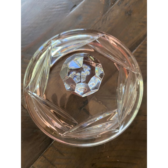 A vintage brilliant cut ice bucket or cookie jar is a beautiful piece made from high-quality glass, showcasing an...