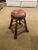 Wood base swivel counter stool features a wood base in a natural warm brown finish with padded seat upholstered in...