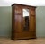 An impressive Edwardian triple wardrobe by renowned Glasgow cabinet makers A. Gardner & Son, retaining its original...