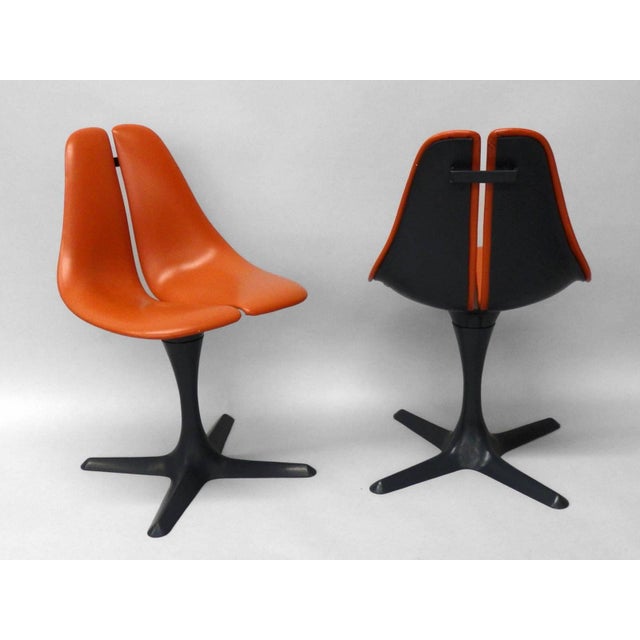 Pair of pedestal chairs by Maurice Burke for Arkana. Split seat swivels on top of X cross bases . Split seat is a nice...
