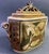Although this unique covered urn captures circus scenes that are decidedly populist in nature, this piece is highly...