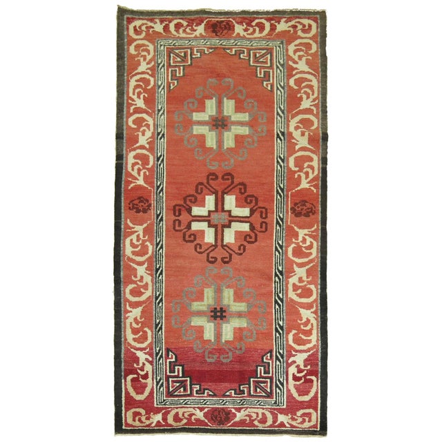 A one of a kind Turkish rug influenced by 19th century east Turkmenistan Khotan rugs. 3 round medallions on a rose ground,...