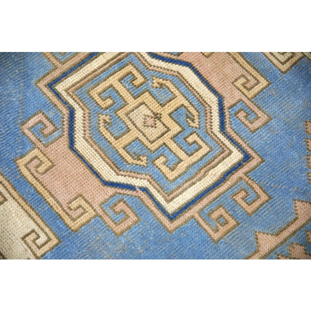 Introducing a one-of-a-kind vintage Turkish hand-knotted wool rug, carefully crafted by skilled artisans using traditional...