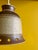 This vintage 1970s Danish ceramic pendant lamp features a textured, speckled beige and brown stoneware body with...