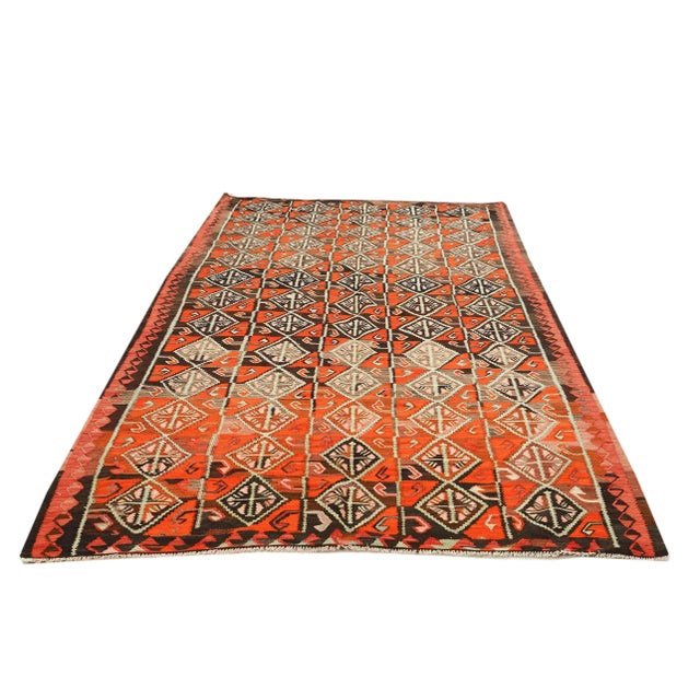 Decorative handwoven vintage kilim rug from Kars region of Turkey. Approximately 50-60 years old. In very good condition.